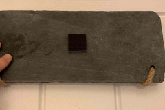 One of the smaller pads on the back of the swinging door sign