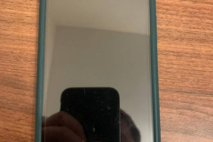 The front of the phone with the case on