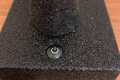 The power button on the base of the tree