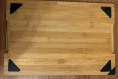 The bottom of the chopping board showing the feet