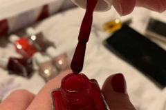 The brush showing the nail polish consistency