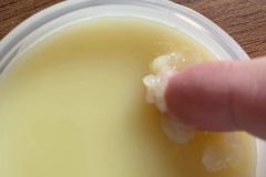 Pushing the balm with my finger to show the consistency