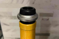 A stopper on a bottle of wine - it has had the foiled cut with the foil cutter