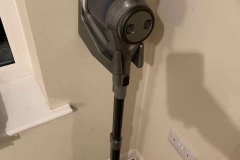 The vacuum cleaner on the wall bracket