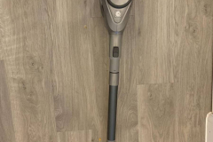The vacuum cleaner laid out on the floor