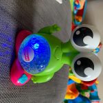 Tomy Toomie Spin & Lights Alien Close up of toy with lights on