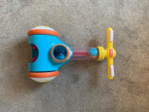 TOMY Toomies Pic & Pop lay on the floor