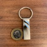 Size comparison of the Moreslon USB flash drive against a one pound coin from the top