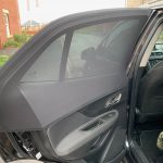 The side window shades from the inside view of the car door